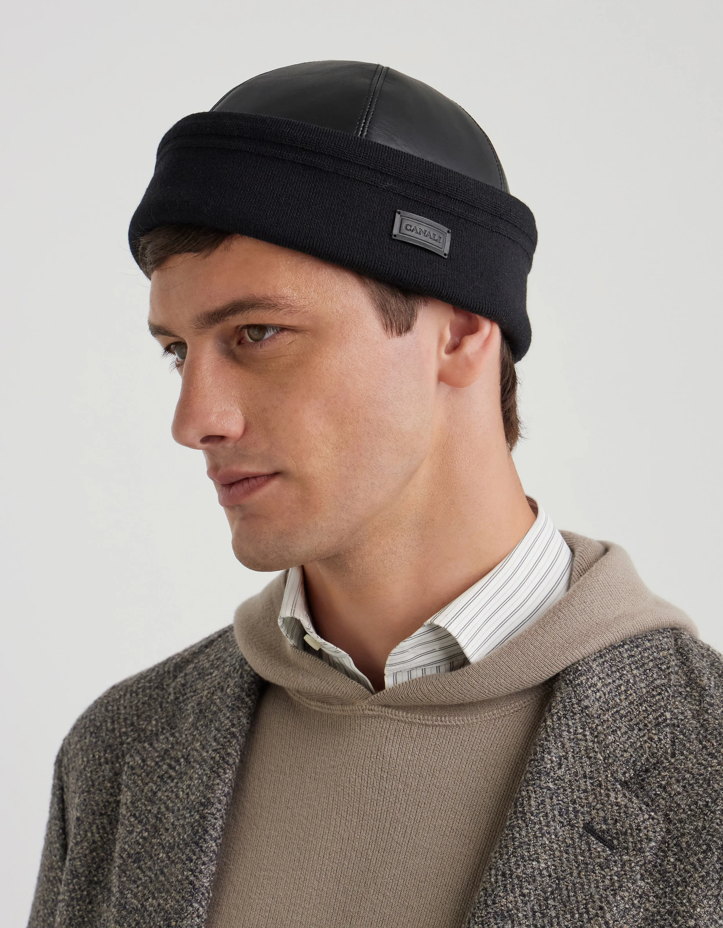 Black leather beanie with knit band and logo tag
