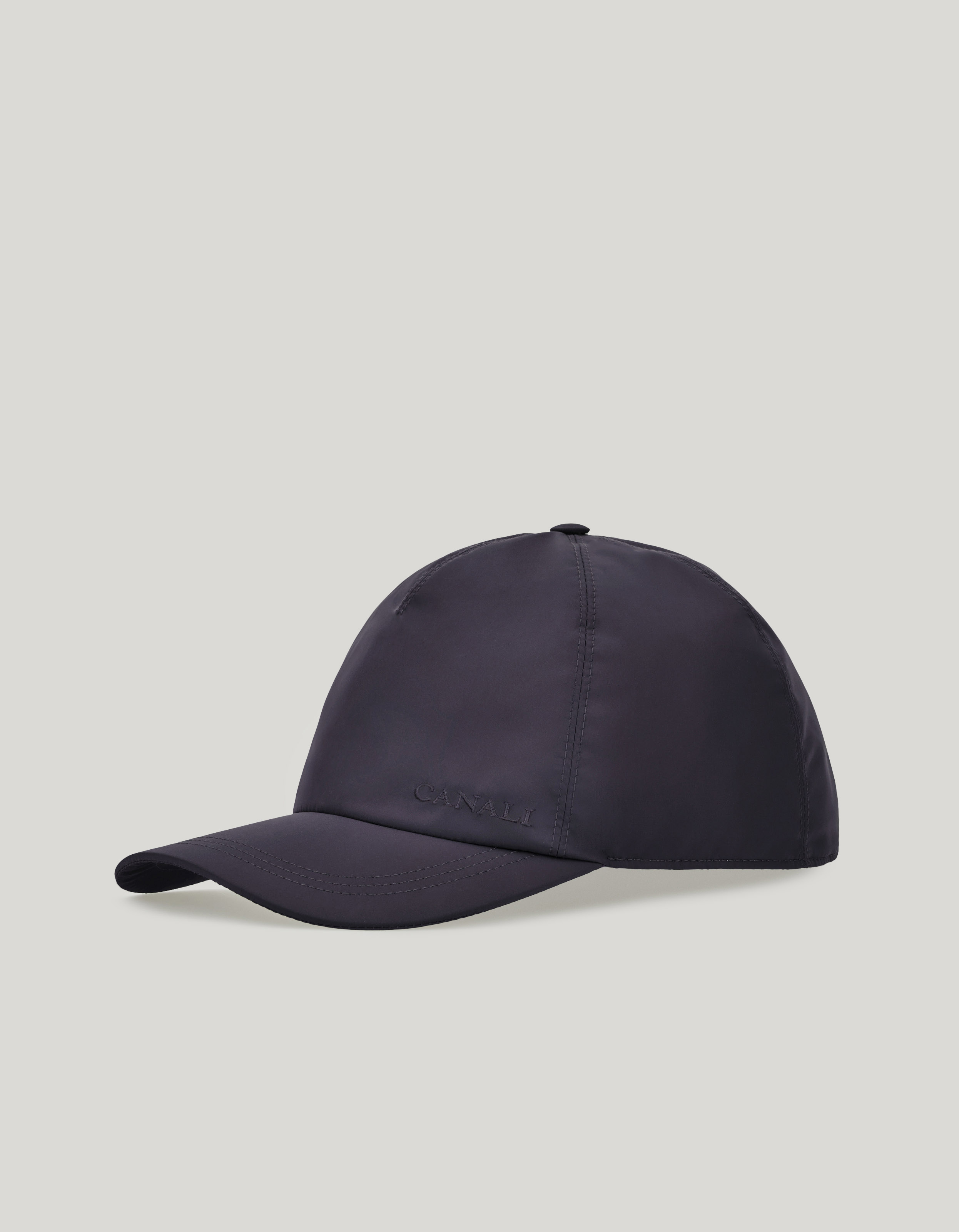 Blue baseball cap with embroidered logo and adjustable leather closure 