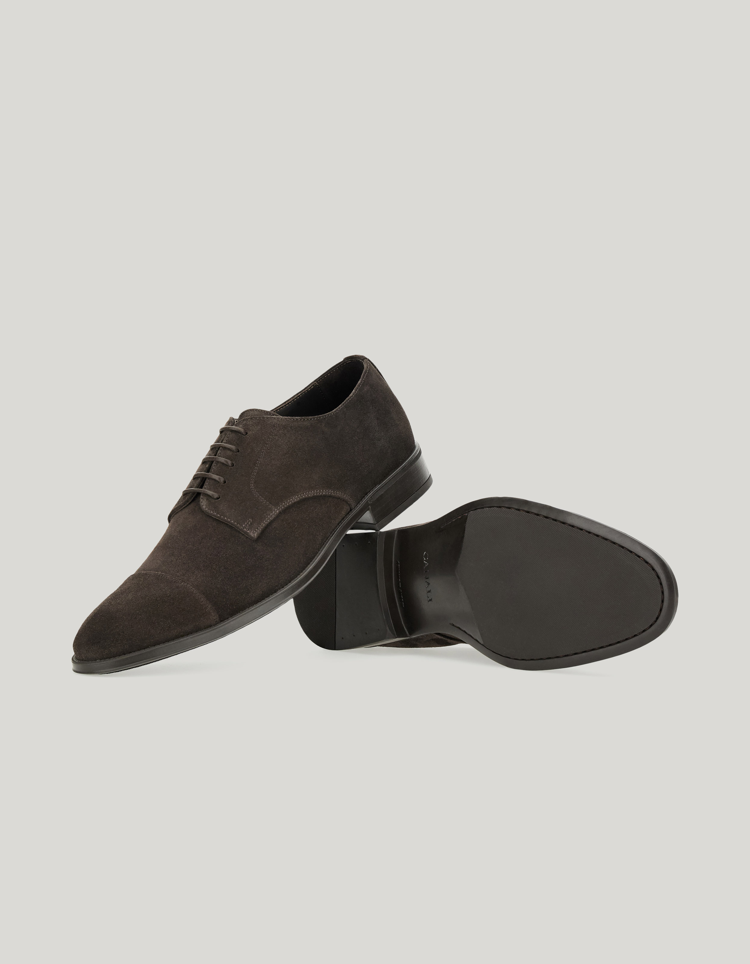 Dark brown suede cap-toe derby with rubber sole